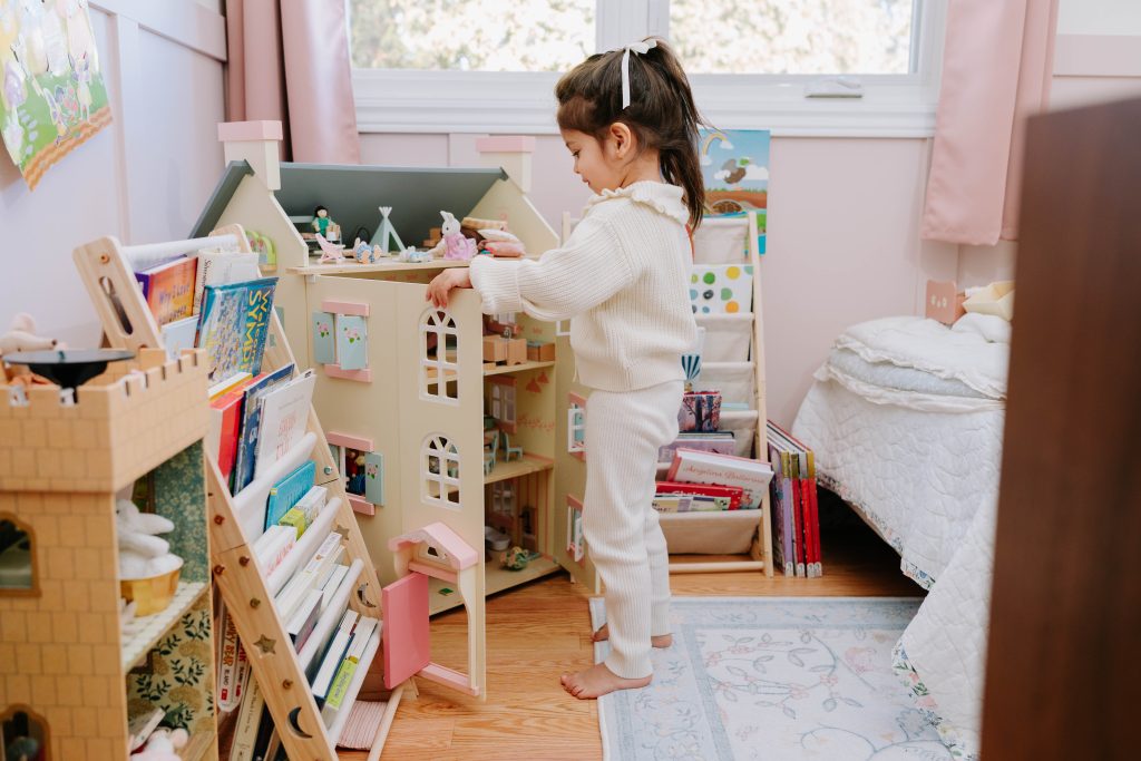 Toddler engaged in play-based pediatric speech therapy at home, supporting language development through interactive learning.